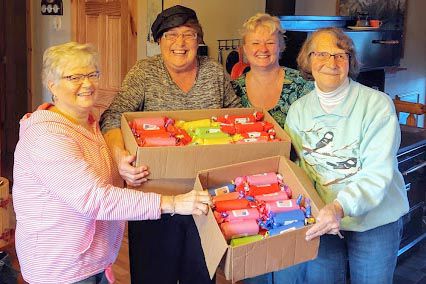 Neighbors and Homemakers groups donate to military